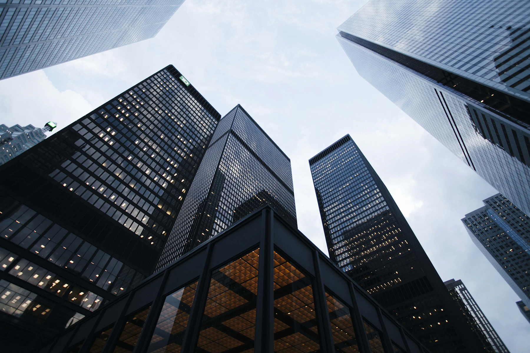 Glass office towers against a pale sky.